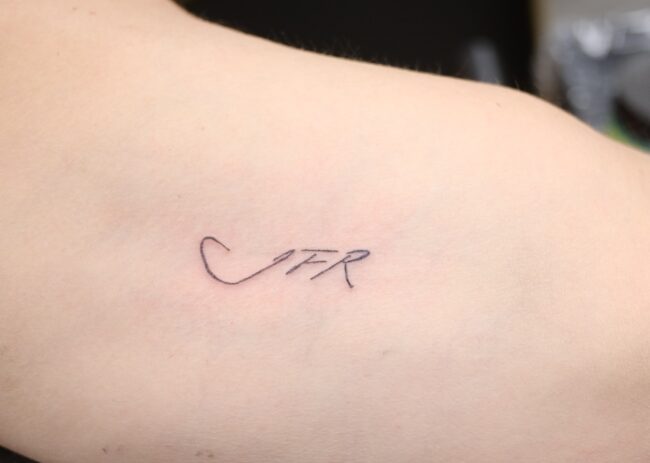 Custom Writing Tattoo